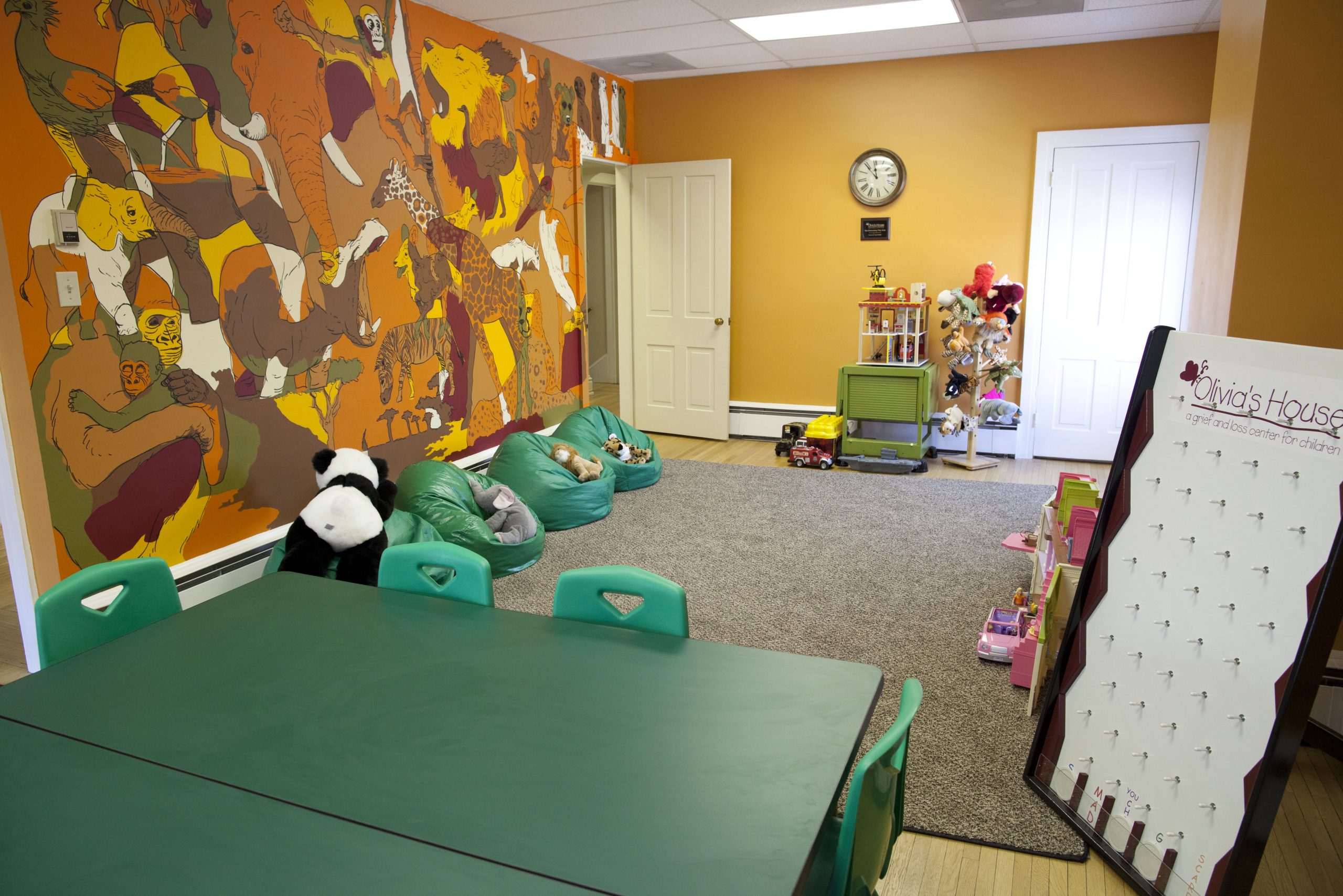 Equipped with grief-related toys and games, the play room serves our youngest mourners, whether they are preschool or elementary school age, and facilitates grief-work through play.  Whether they are enjoying the doll house or the fire house, all the children are able to share their grief stories with our staff.  The mural, painted by Dirk Shearer, is a favorite of the children. The Play Room was lovingly gifted by the Eckert and Noel Families.