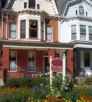 Our York grief center is actually two houses, sitting side by side. One house functions as the center for families, and the other serves as the administrative offices for the staff of Olivia\'s House. The gardens in the front bright with color and energy, were designed to bring \"hope\" to the families as they approach our mission for the first time!