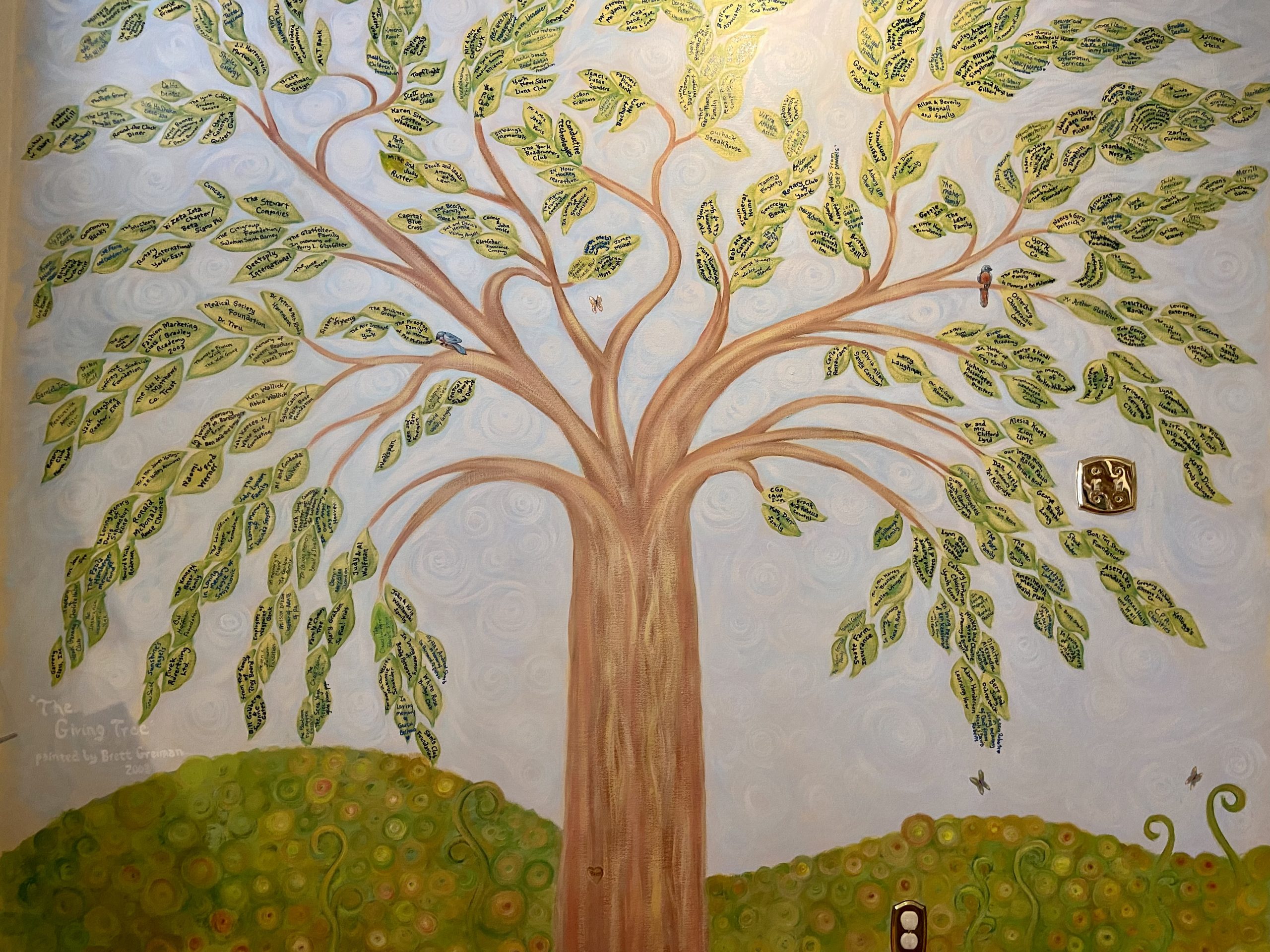Giving Tree Located in the lending library and painted by artist Bret Greiman, the Olivia's House Giving Tree demonstrates how generous our community has been to the mission of Olivia's House. Any individual or organization that makes a gift of $1,000 or more gets to select a leaf to have their name permanently displayed.