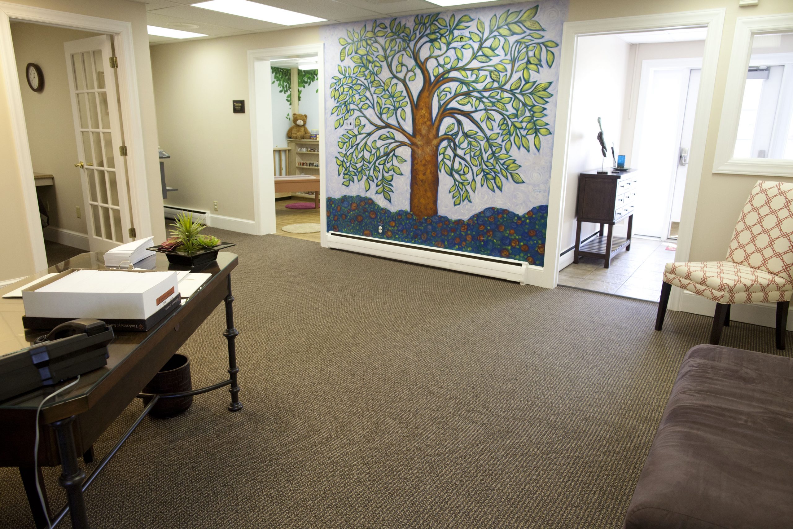 The Welcoming Room Designed to be "welcoming" to children, and lovingly gifted by the Dylan Lissette family in memory of Casey Sheridan, the Welcoming Room is the first room a child enters when visiting Olivia’s House. This large area is often the best place for our program ending “hand shake squeeze”. Our “Giving Tree” mural, designed and painted by Brett Greiman, reflects donors from the community who have made Olivia’s House possible.